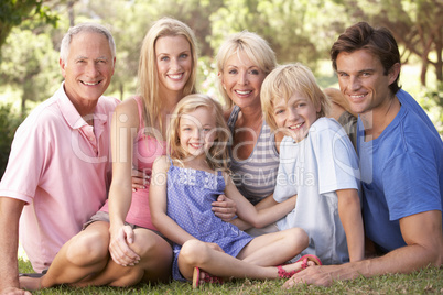 A family, with parents, children and grandparents, relaxing in a