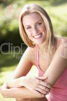 Portrait Of Young Woman Relaxing In Park