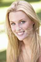 Portrait Of Young Woman Relaxing In Park