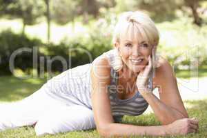 Middle age woman posing in park