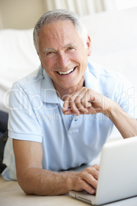 Senior man using laptop computer