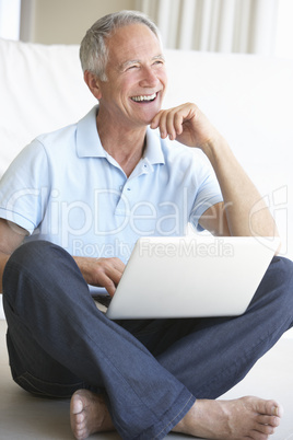 Senior man using laptop computer