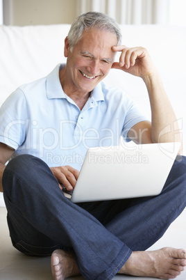 Senior man using laptop computer