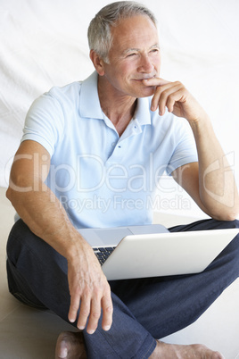 Senior man using laptop computer