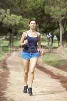 Young woman running in park