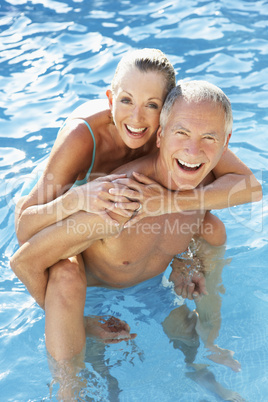 Senior couple having fun in pool