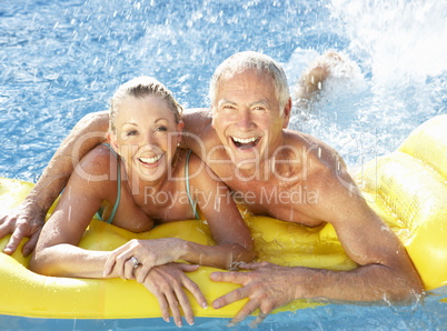 Senior couple having fun in pool