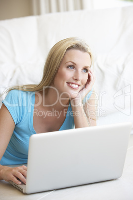 Young woman on her laptop computer