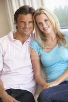 Young couple posing indoors