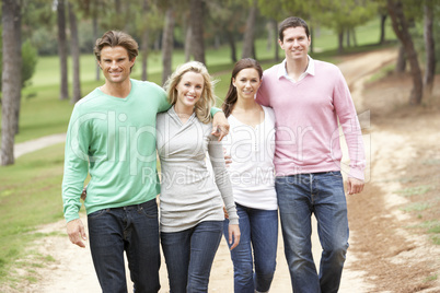 Group of friends enjoying walk in park