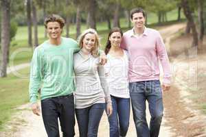 Group of friends enjoying walk in park