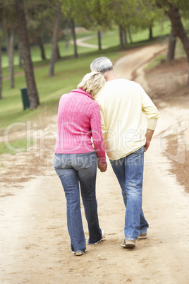 Senior Couple enjoying walk in park