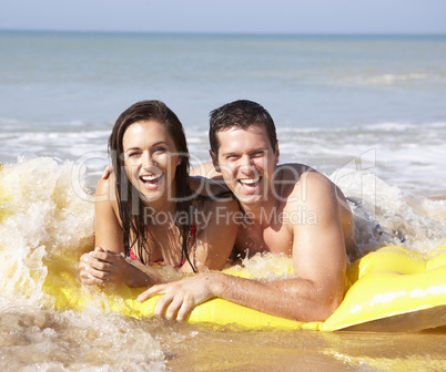 Young couple on beach holiday