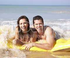 Young couple on beach holiday