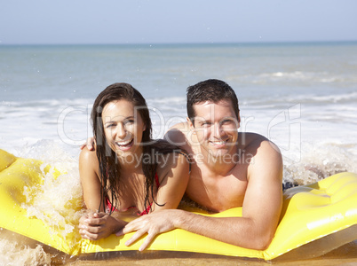 Young couple on beach holiday