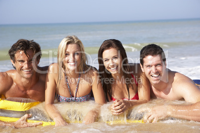 Two young couples on beach holiday