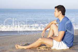Man sitting on beach relaxing