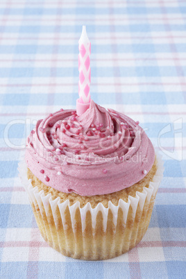 A cupcake with a candle A cupcake with a candle