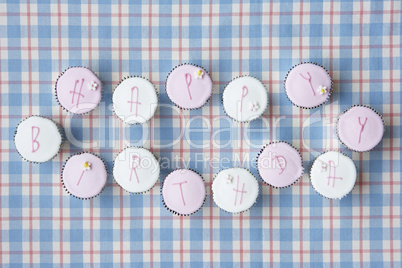 Cupcakes spell out happy birthday