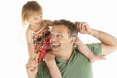 Young man carries child on shoulders