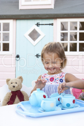 A young girl plays outdoors