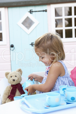 A young girl plays outdoors
