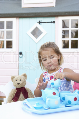 A young girl plays outdoors