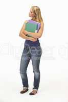 Studio Portrait Of Female Student Holding Folders