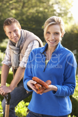 Young couple posing in garden