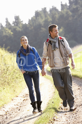 Young couple walking in park