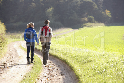 Young couple walking in park