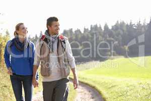 Young couple walking in park