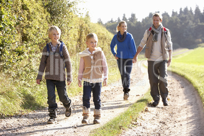 Young family walking in park