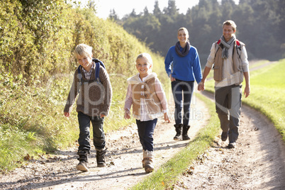 Young family walking in park