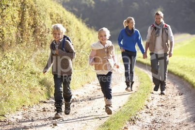 Young family walking in park