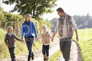 Young family walking in park