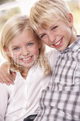 Two young children pose together