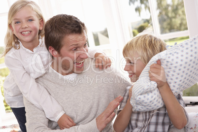 Man and children play together