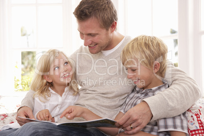 Man and children reading together