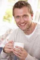 Man drinking from cup