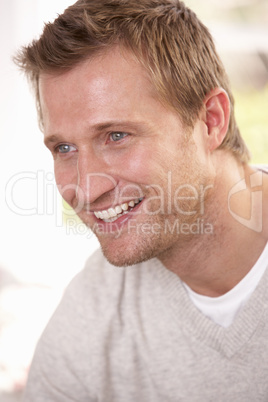 Young man poses in studio