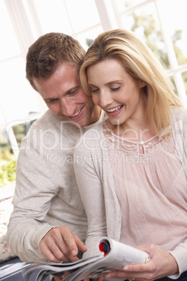 Young couple reading together