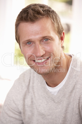 Young man poses in studio