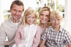 Young family pose together