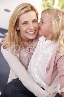 Woman and child pose in studio