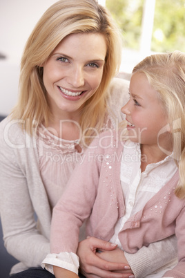 Woman and child pose in studio