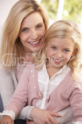 Woman and child pose in studio