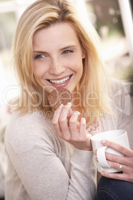 Woman drinking from cup