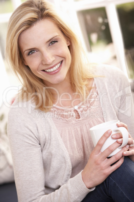 Woman drinking from cup