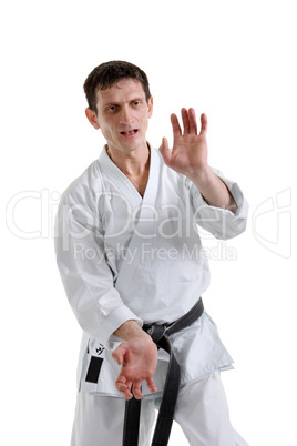 Karate. Man in a kimono with a white background